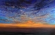 As sinks the sun within that world of wine